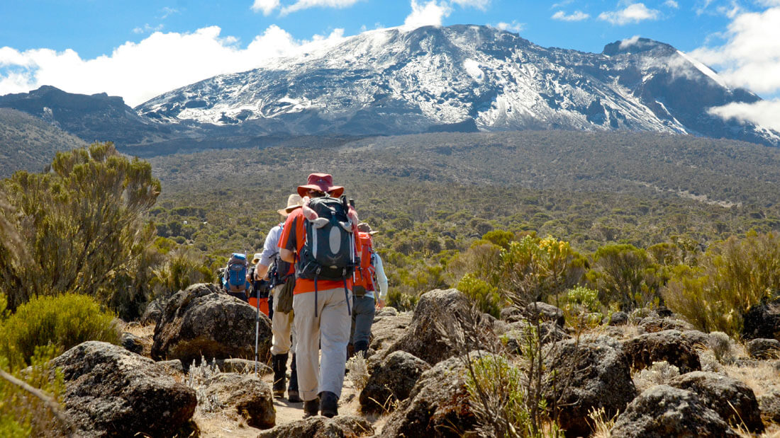 Trekkers crossing high-altitude terrain toward the Shira Plateau on Kilimanjaro
